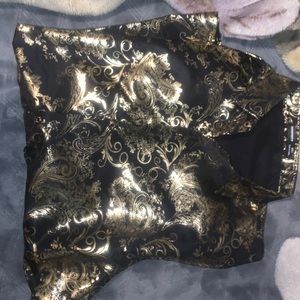 Beautiful black shirt with golden designs.